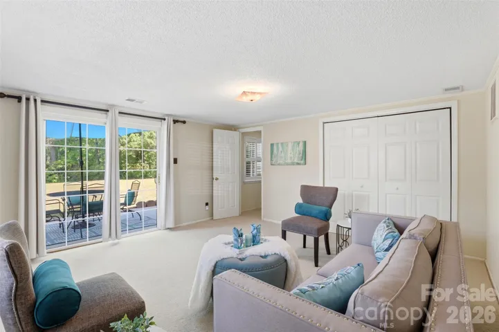 Bonus room opens onto a spacious patio area. Closet is a great space for storage.
