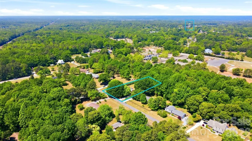 Lot goes beyond the fence to the creek-bed.  Distance to water tower.