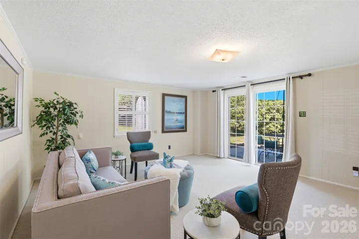 Wide view of bonus room is flooded with natural light