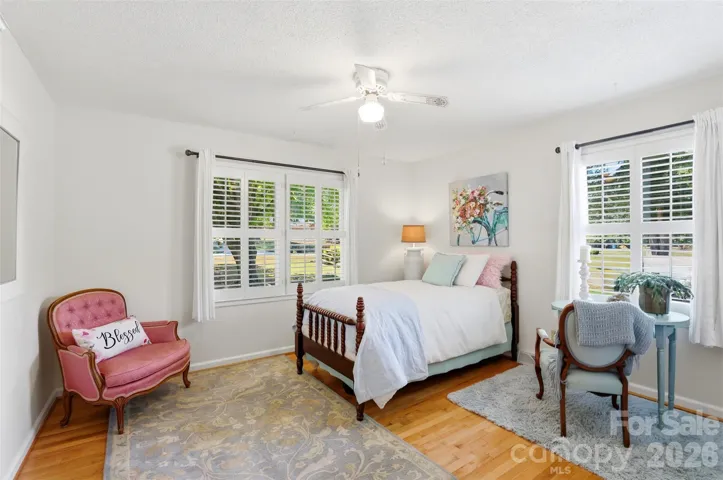 The corner bedroom is oversized and filled with light from corner windows