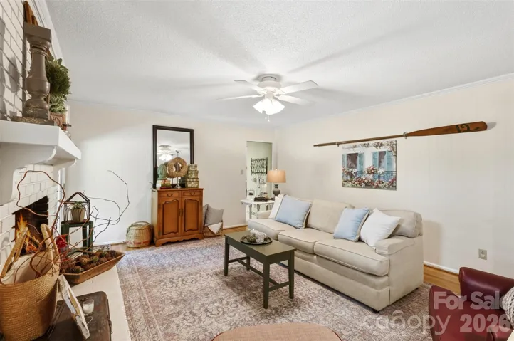 Beautifully appointed family room flanked by a screened in porch and kitchen