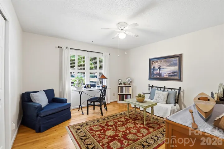 First of three bedrooms is being used as a home office
