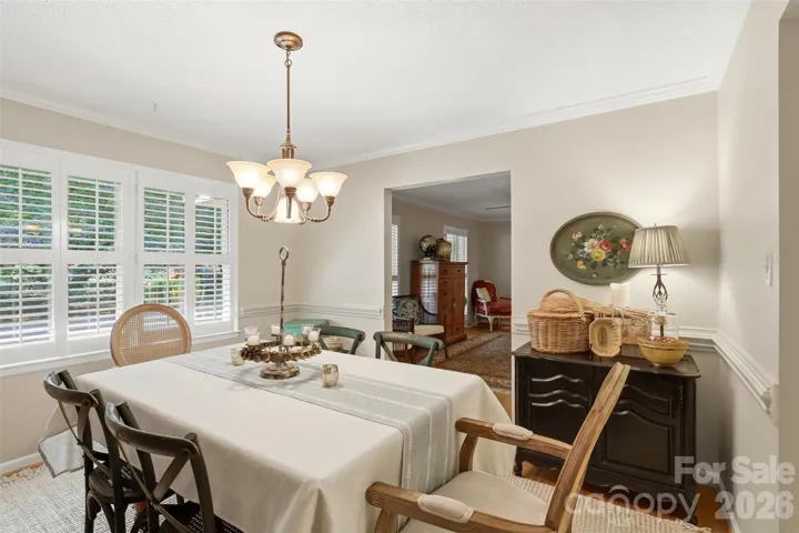 Lovely plantation shutters in the windows add bright frames to the many windows throughout