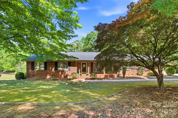 This full brick ranch is filled with charm and steps away from one of the most desirable small towns in our region!