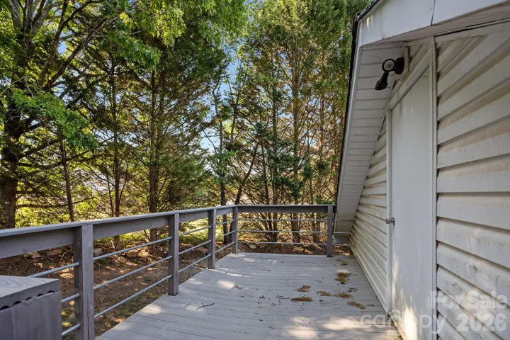 Deck/access to unfinished bonus/storage area above detached garage.