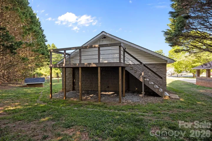 Exterior access to unfinished bonus/storage area above detached garage. 