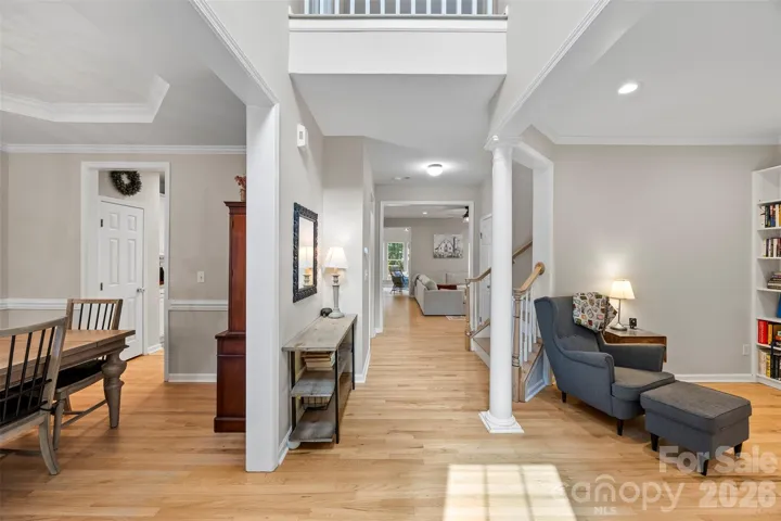 Entry foyer with dining room on left and office/study/den on right