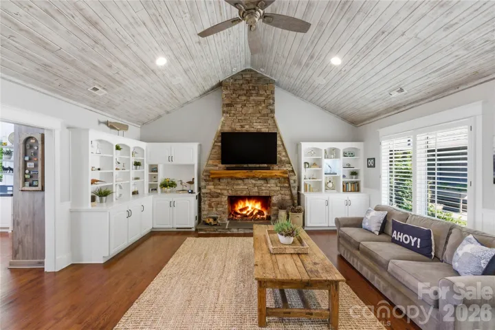 Spacious great room with built-ins and a fireplace is designed with entertaining in mind 