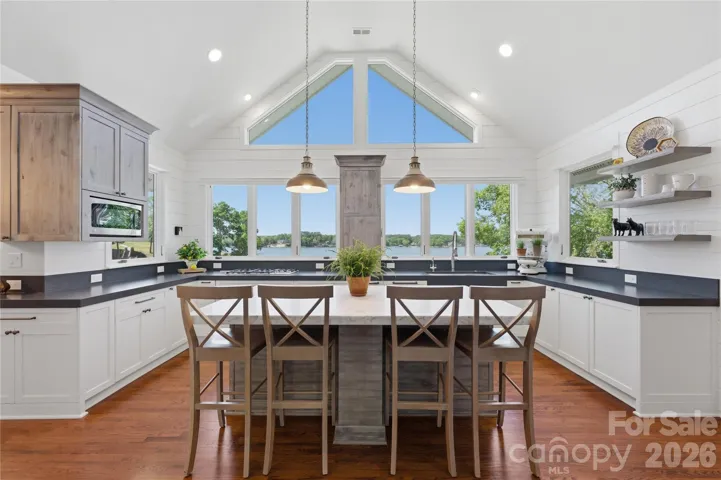 Gourmet kitchen, complete with marble countertops, a large center island, walk-in pantry, and premium appliances 