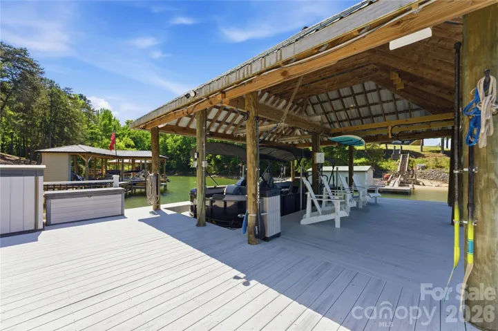 The private covered dock with lift and floating dock offers direct access to Lake Wylie for boating and recreation