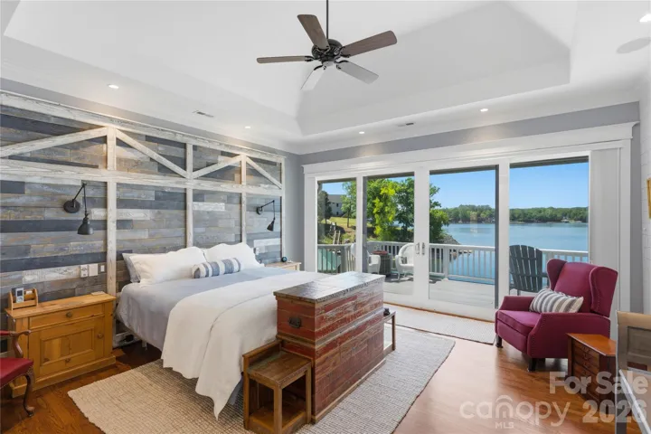 The luxurious primary suite is a true retreat, featuring dual walk-in closets, a spa-inspired bath with heated floors, and a private laundry area