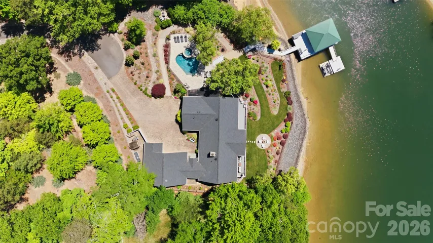 A rare opportunity to own a custom waterfront retreat in a prime Charlotte-area location