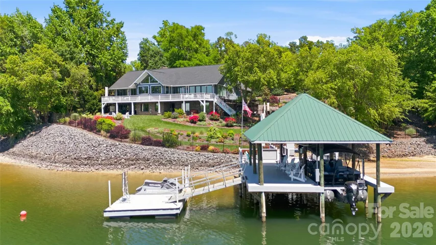 The private covered dock with lift and floating dock offers direct access to Lake Wylie for boating and recreation