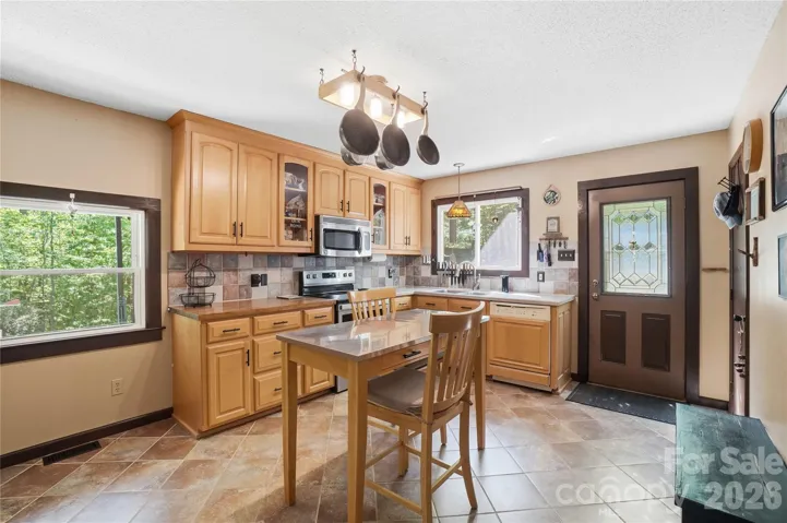 Spacious kitchen with eat-in area overlooking gorgeous outdoor views