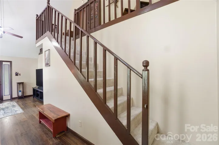 Stairs to upper loft and primary bedroom