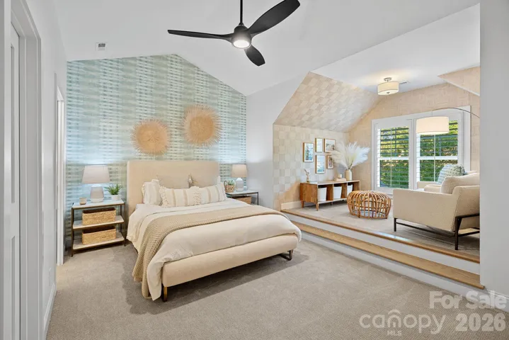 Bedroom #2 features an adorable seating area and custom wall paper.