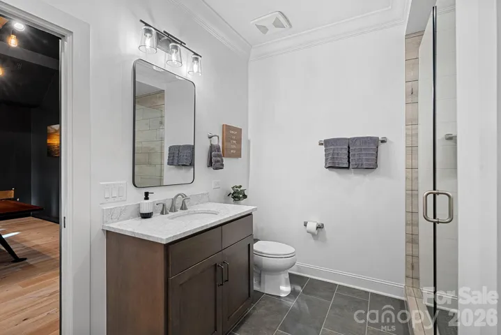 Ensuite full bath #4 with a large walk-in shower.  Connects to the game room
