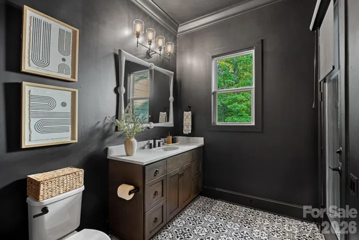 Half bath with access to the screened porch. 