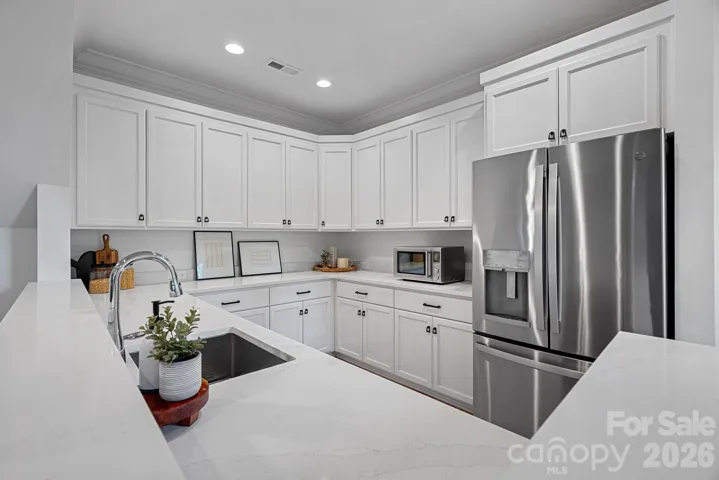 Kitchen in bonus room.  Would make a perfect space for an au pair, extended family or entertaining area.