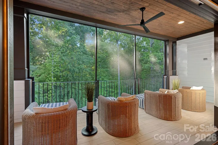 Upper level screened porch off game room - pocket sliding glass doors and a serene view of the backyard