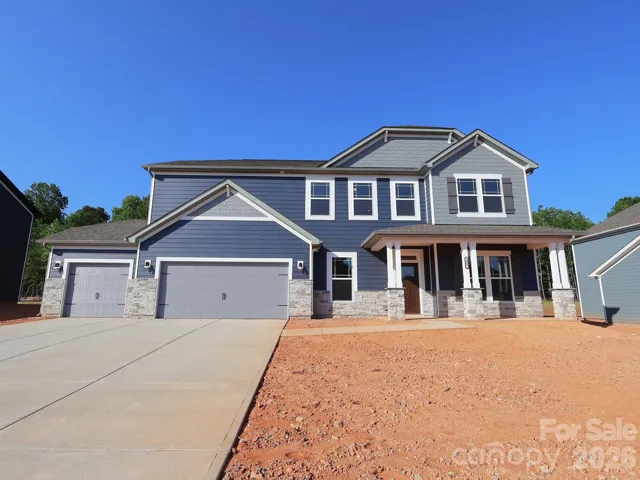Exterior. Home will receive sod once sold