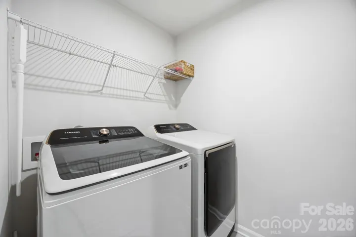 Laundry room conveniently located upstairs