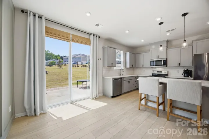 Sliding glass doors lead to the rear patio