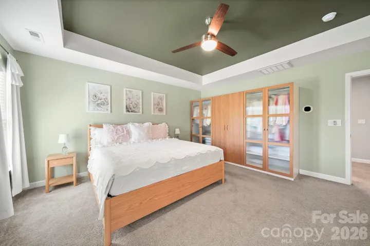 primary bedroom with custom built in armoire