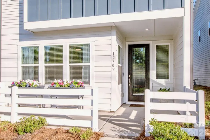 inviting covered front entry with planters 