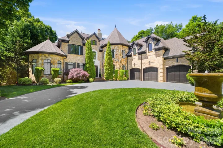 three car garage & circular drive