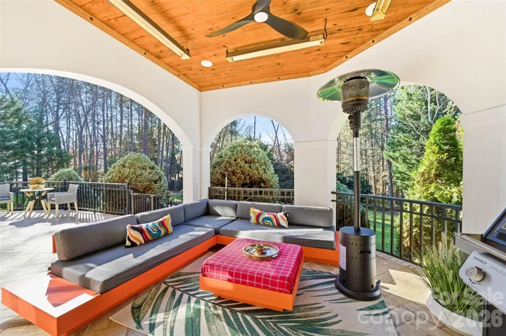 covered deck with partial lake views