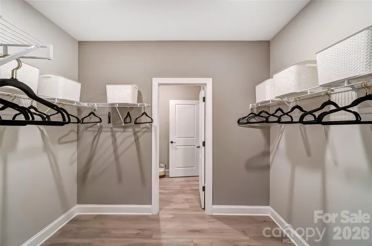 Primary closet connects to laundry room