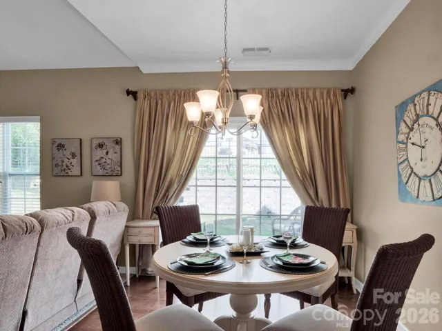 Comfortable and inviting dining room with access to the patio.