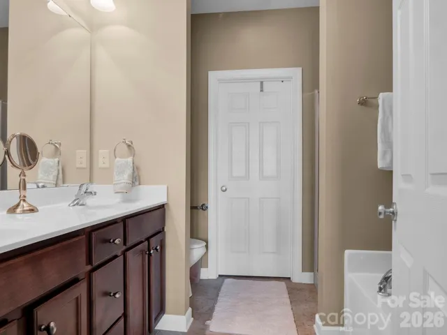 Primary bedroom's on-suite bathroom with garden tub and separate shower