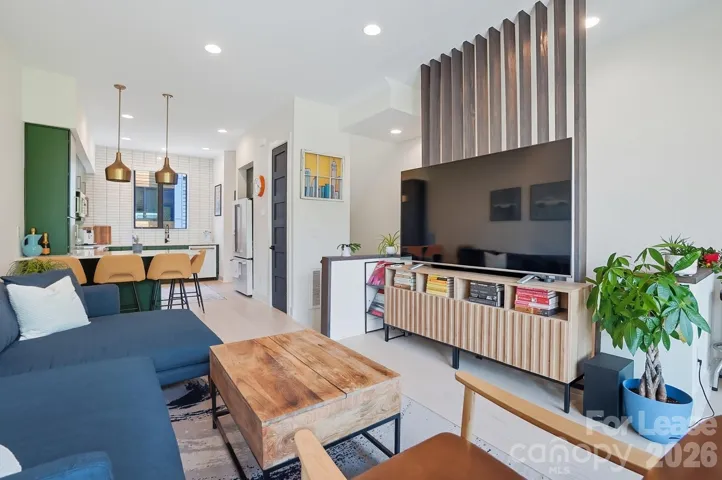 Seamless flow from the kitchen to the bright, light filled living area. 