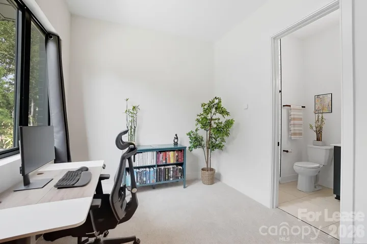 Lower level bedroom / office with attached full bathroom. 