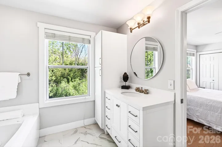 Primary bath vanity and linen closet