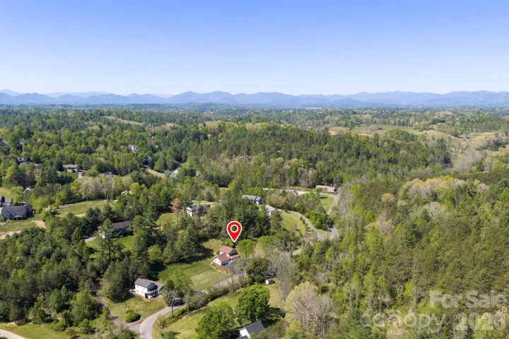 Aerial mountain and valley view with property marker