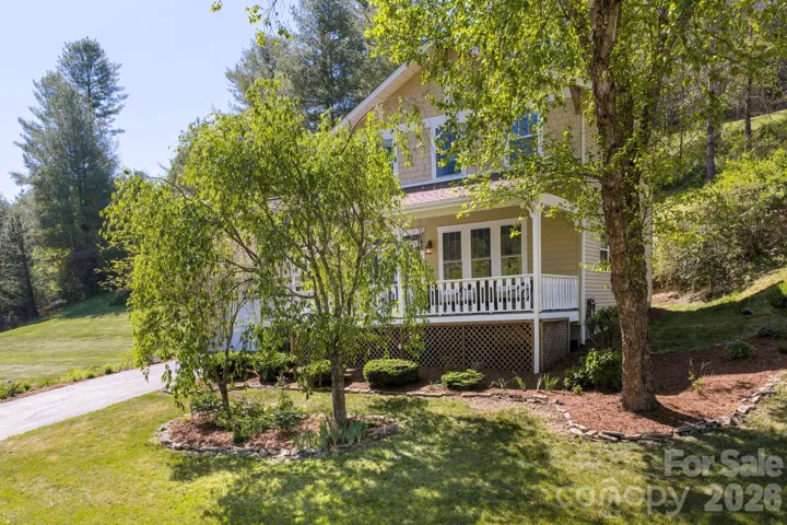 Front exterior and covered porch from side yard