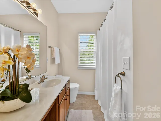 Well-appointed full bath featuring a spacious vanity, shower/tub combo, and natural light for a bright, functional space.