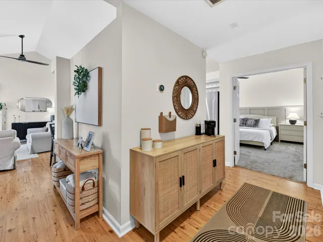 Light-filled hallway features stylish accent trim, and a welcoming flow connecting the main living spaces and bedrooms.