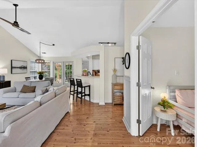 Bright and welcoming foyer with warm floors, abundant natural light, and an open flow into the main living areas.