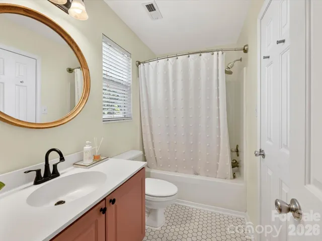 Bright and stylish full bathroom features updated finishes, a tub/shower combo, and modern fixtures with a fresh, inviting feel.