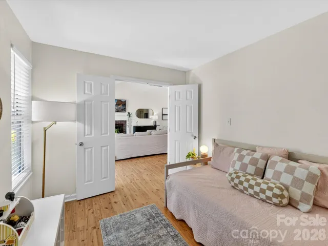 Versatile secondary bedroom or flex space offers ample natural light, and a layout perfect for a home office, playroom, or guest room.