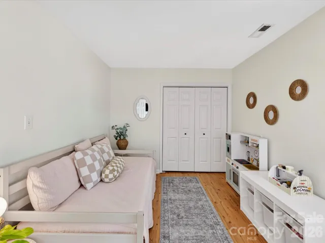 Versatile secondary bedroom or flex space offers ample natural light, and a layout perfect for a home office, playroom, or guest room.