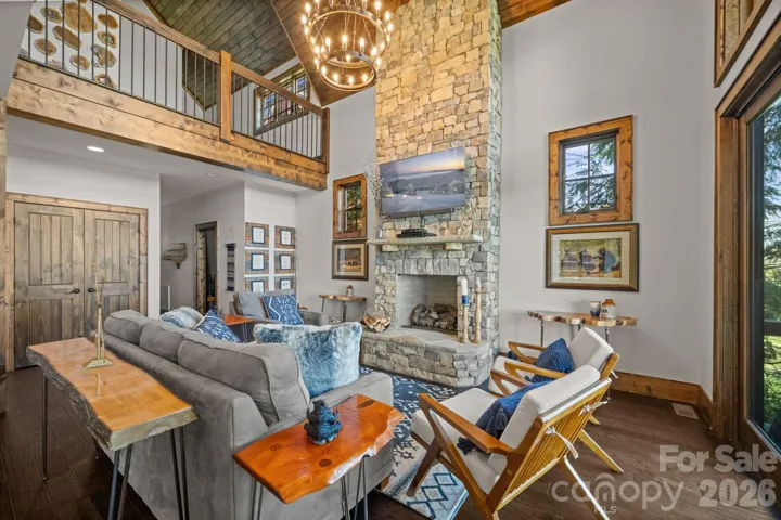 Floor to ceiling stone fireplace with gas logs