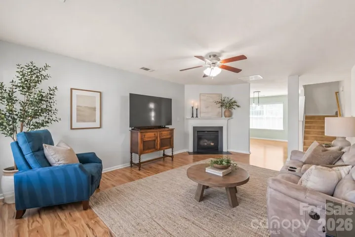 Spacious Living Room with Gas Log Fireplace - Decor has been virtually added