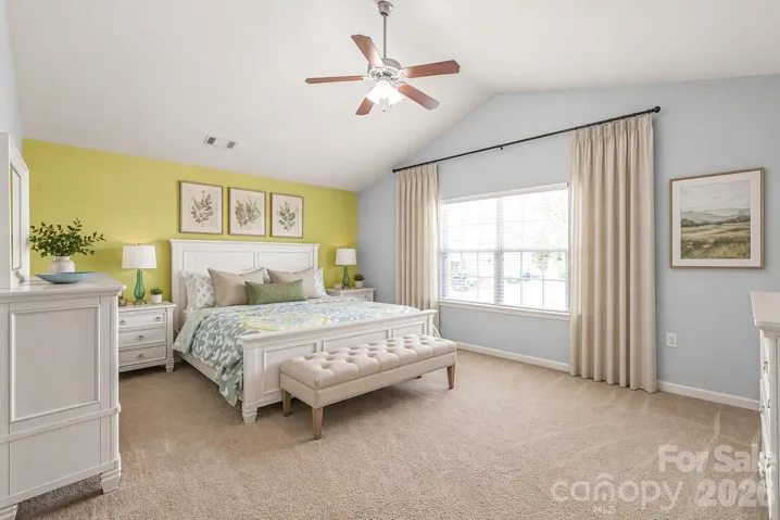 Stunning Primary Bedroom with Vaulted Ceilings - Decor has been virtually added