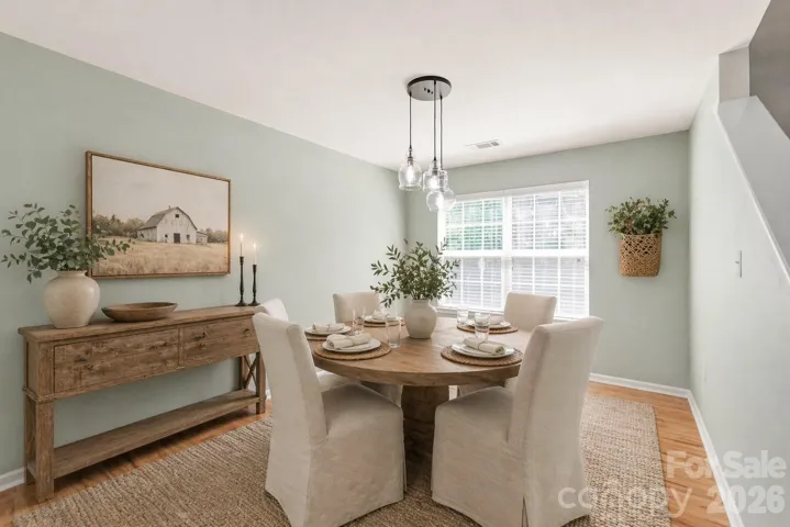 Bright and Airy Dining Room with Updated Lighting -Decor has been virtually added