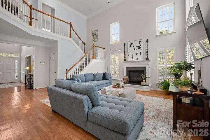 2 story great room featuring plantation shutters